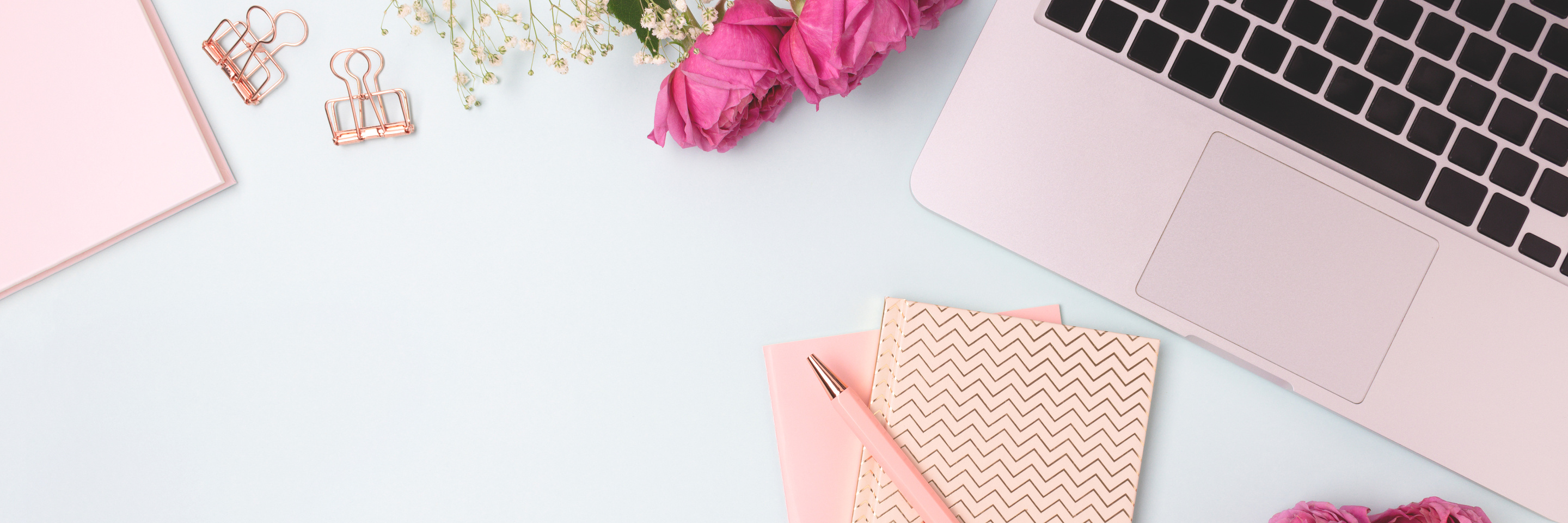 Laptop and Stationery on White Desk Top View 
